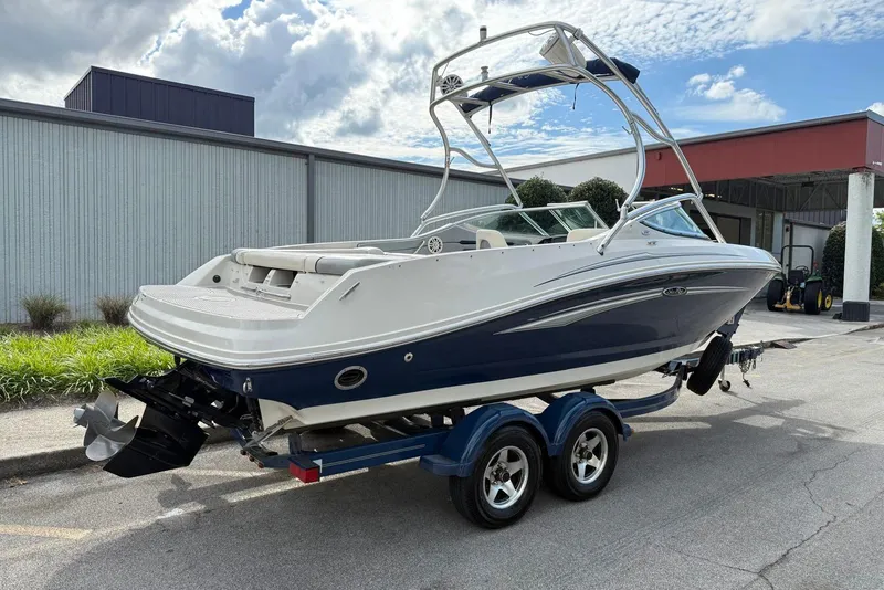 Slide: The Image of 2008 Sea Ray 230 Bow Rider Select boat on trailer, parked outdoors. - 7