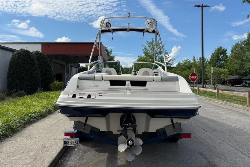 Slide: The Image of 2008 Sea Ray 230 Bow Rider Select boat, rear view, parked on a trailer. - 8