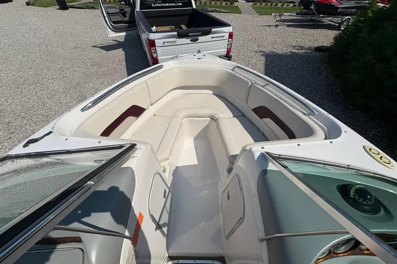 Slide: The Image of 1997 Chaparral 2130 Sport boat interior with white seating and open bow design. - 6