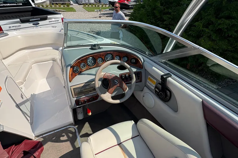 Slide: The Image of 1997 Chaparral 2130 Sport boat interior with steering wheel and dashboard controls. - 8