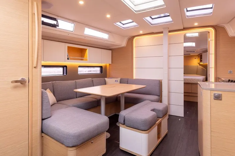 Slide: The Image of Modern interior of 2024 Dufour 41 yacht with spacious seating and natural light. - 14