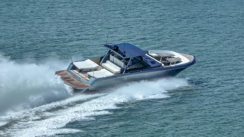 Slide: The Image of 2024 CNM CONTINENTAL 54 SuperSport yacht cruising on open water. - 12