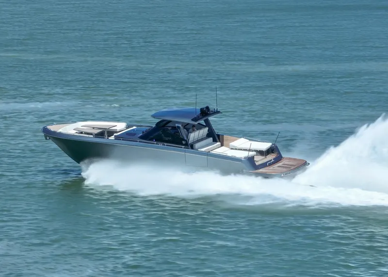 Slide: The Image of 2024 CNM CONTINENTAL 54 SuperSport yacht speeding on open water. - 13