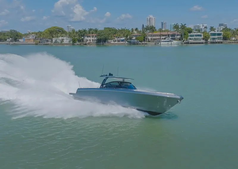 Slide: The Image of 2024 CNM CONTINENTAL 54 SuperSport speeding on a scenic waterway. - 17