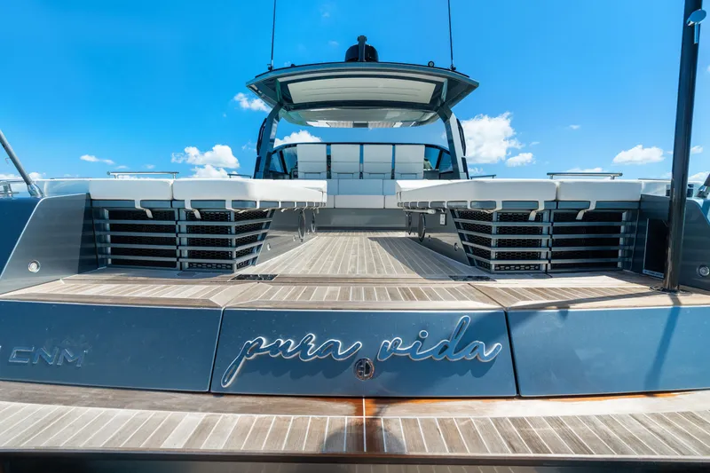 Slide: The Image of 2024 CNM CONTINENTAL 54 SuperSport yacht with "pura vida" inscription, rear view. - 19