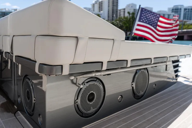 Slide: The Image of 2024 CNM CONTINENTAL 54 SuperSport yacht with speakers and American flag. - 28