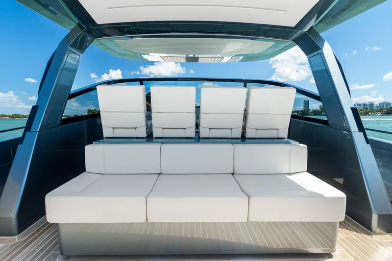 Slide: The Image of 2024 CNM CONTINENTAL 54 SuperSport yacht interior with luxurious white seating. - 29