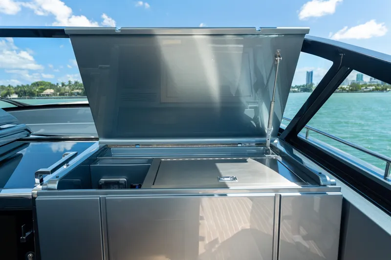 Slide: The Image of 2024 CNM CONTINENTAL 54 SuperSport yacht with open deck storage, ocean view. - 40