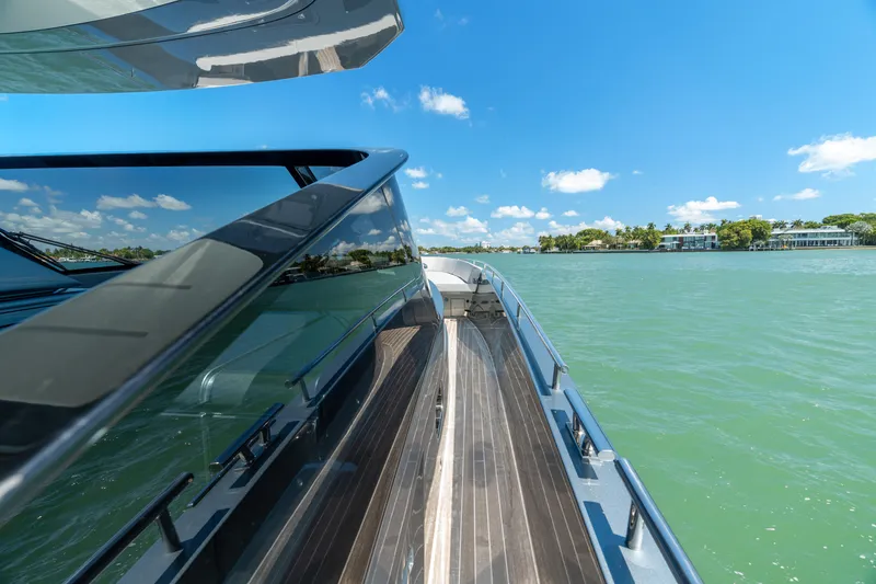 Slide: The Image of 2024 CNM CONTINENTAL 54 SuperSport yacht on serene water under clear blue sky. - 42