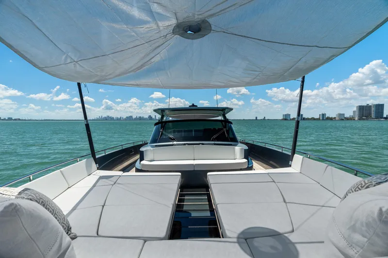 Slide: The Image of 2024 CNM CONTINENTAL 54 SuperSport yacht with sunshade on open water. - 48