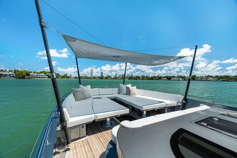 Slide: The Image of Luxurious 2024 CNM CONTINENTAL 54 SuperSport yacht with spacious deck and sunshade on open water. - 49