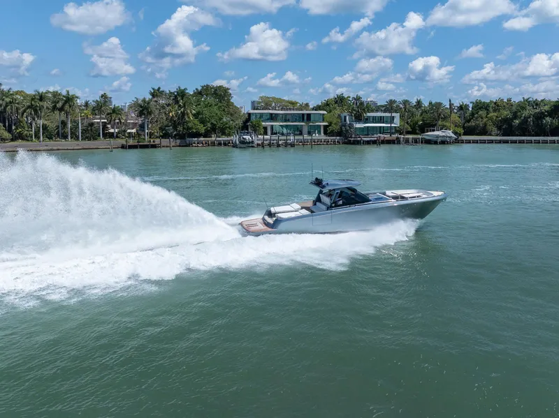 Slide: The Image of 2024 CNM CONTINENTAL 54 SuperSport yacht cruising on a sunny day. - 5