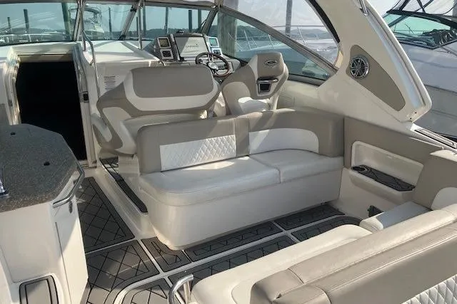 Slide: The Image of 2010 Chaparral Signature 310 boat interior with modern seating and steering area. - 3