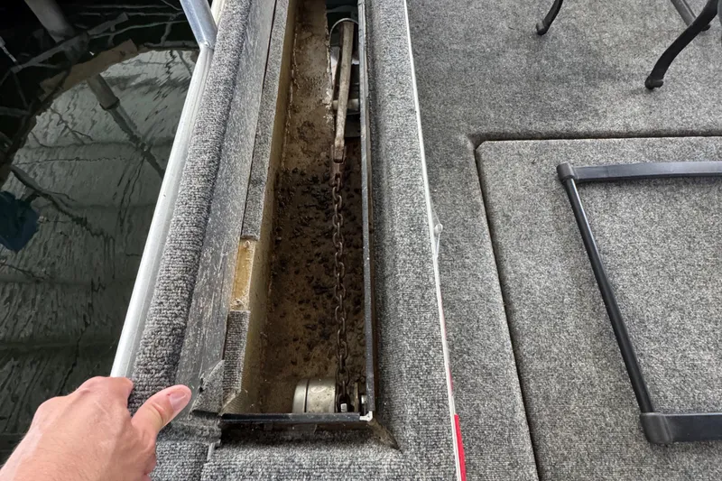 Slide: The Image of 2002 Sumerset houseboat helm with scenic lake view and modern navigation equipment. - 13