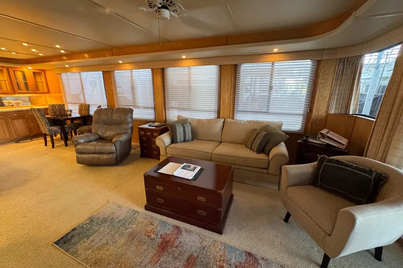 Slide: The Image of 2002 Sumerset houseboat helm with TV, overlooking scenic lake and forested shoreline. - 15