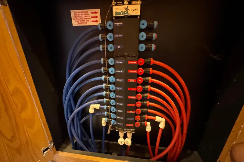 Slide: The Image of 2002 Sumerset houseboat on a serene lake with lush green shoreline. - 29