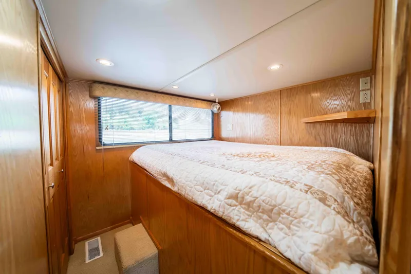 Slide: The Image of Cozy bedroom in 2002 Sumerset houseboat with wood paneling and natural light. - 42