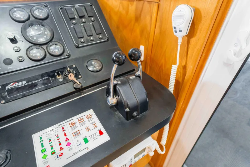 Slide: The Image of Control panel of a 2002 Sumerset houseboat with gauges and navigation aids. - 53