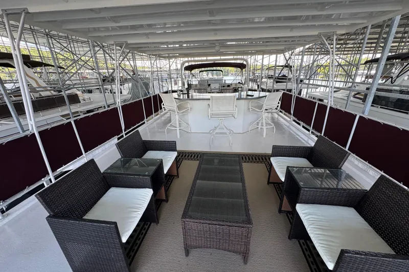 Slide: The Image of 2002 Sumerset houseboat cruising under a bridge on a scenic river. - 8