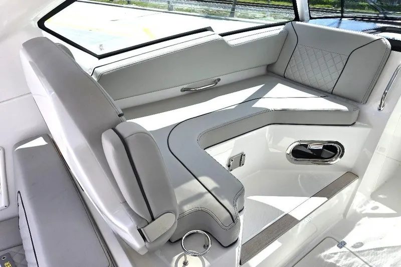 Slide: The Image of 2024 Pursuit DC 326 Dual Console interior with luxurious seating and modern design. - 10