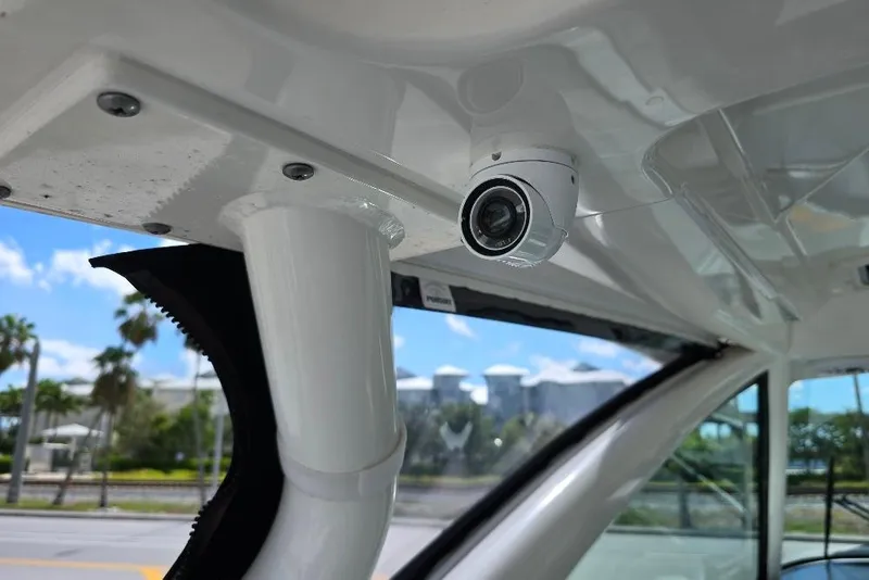 Slide: The Image of 2024 Pursuit DC 326 Dual Console boat interior with mounted security camera. - 31