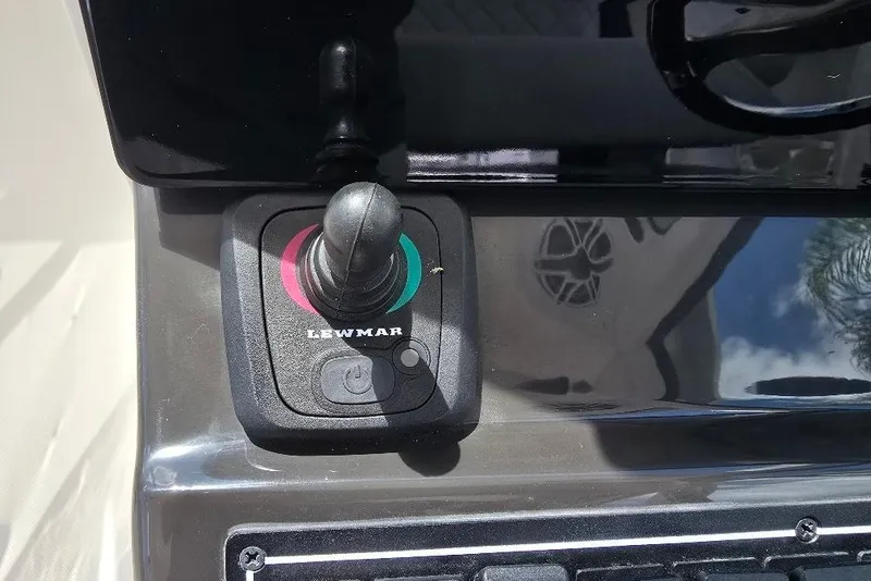 Slide: The Image of Joystick control on 2024 Pursuit DC 326 Dual Console boat dashboard. - 4
