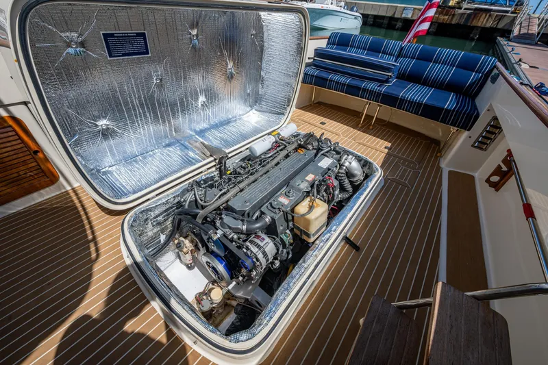 Slide: The Image of 2001 Hinckley Picnic Boat Classic engine compartment with open hatch, showcasing detailed mechanics. - 18