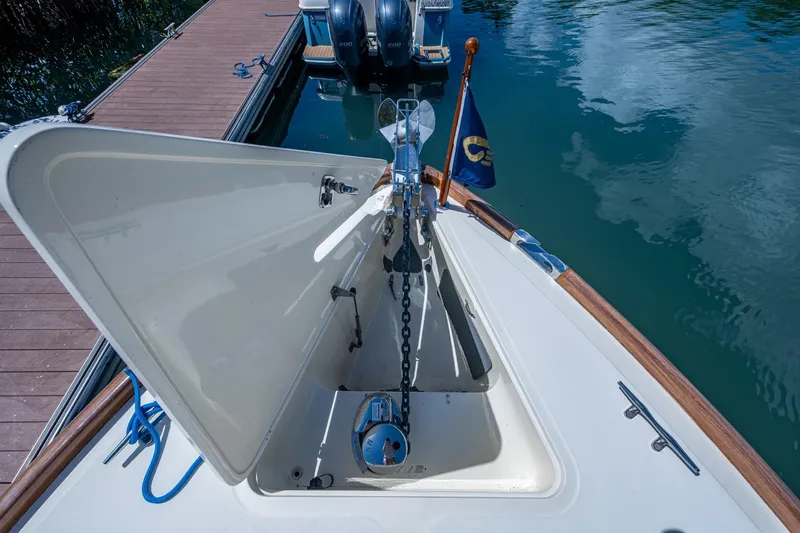 Slide: The Image of 2001 Hinckley Picnic Boat Classic anchor compartment at dockside. - 19