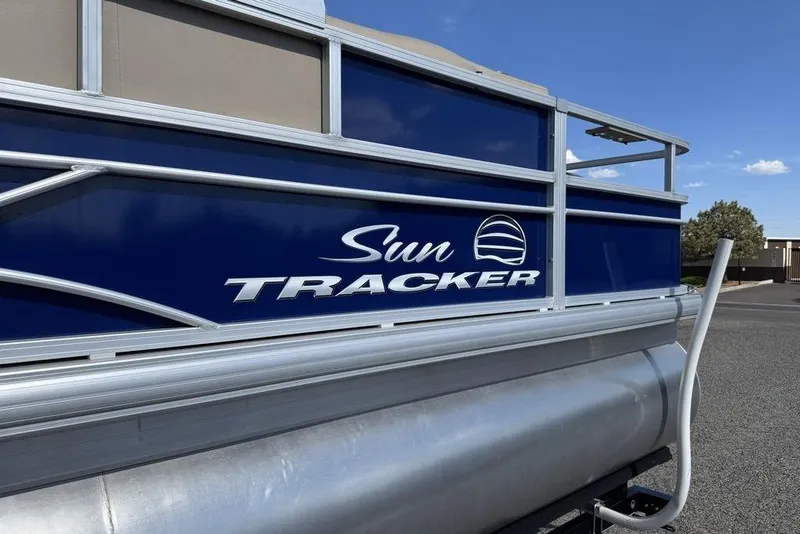 Slide: The Image of 2017 Sun Tracker FISHIN' BARGE® 20 DLX pontoon boat, blue exterior, side view. - 10