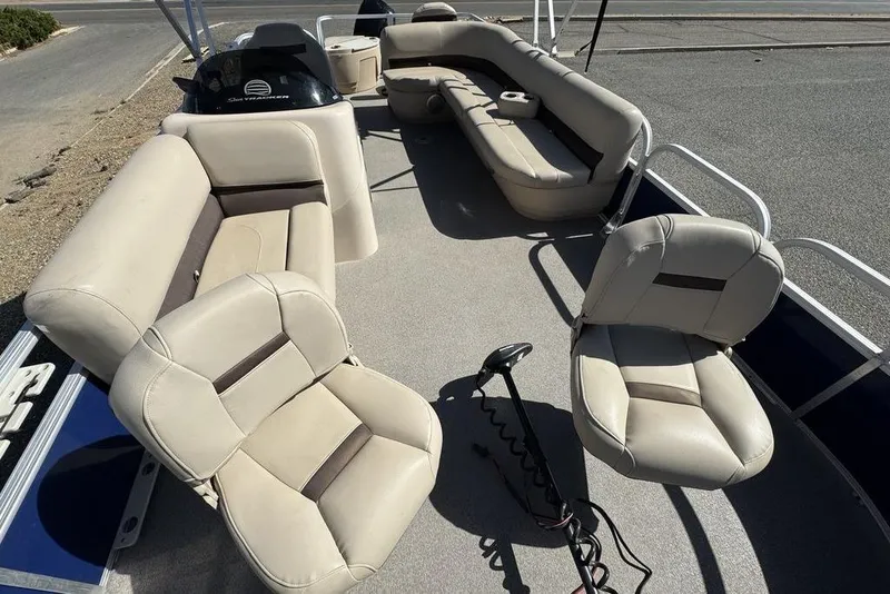 Slide: The Image of 2017 Sun Tracker FISHIN' BARGE® 20 DLX pontoon boat interior with beige seating. - 17