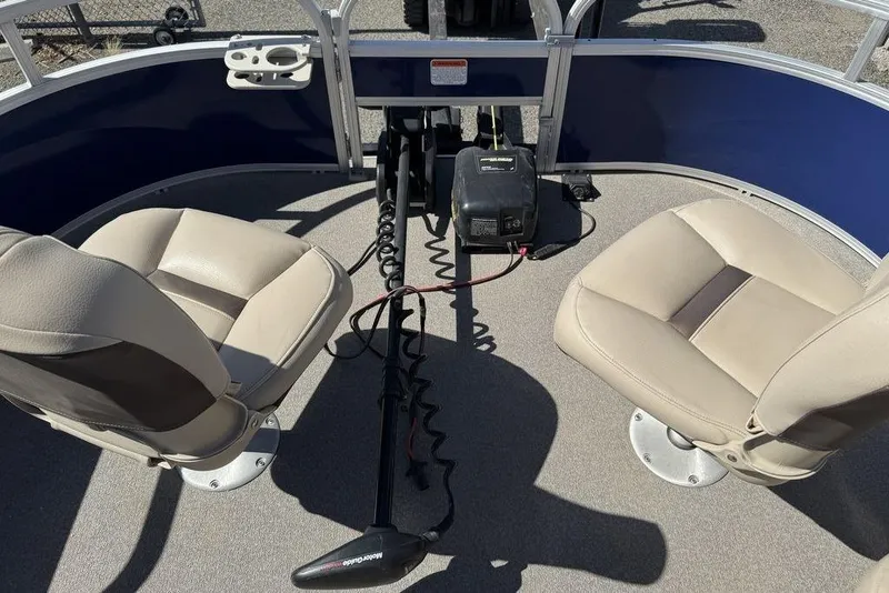 Slide: The Image of 2017 Sun Tracker FISHIN' BARGE® 20 DLX interior with two seats and fishing equipment. - 27