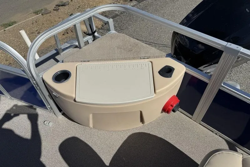 Slide: The Image of 2017 Sun Tracker FISHIN' BARGE® 20 DLX deck with storage compartment and cup holder. - 34