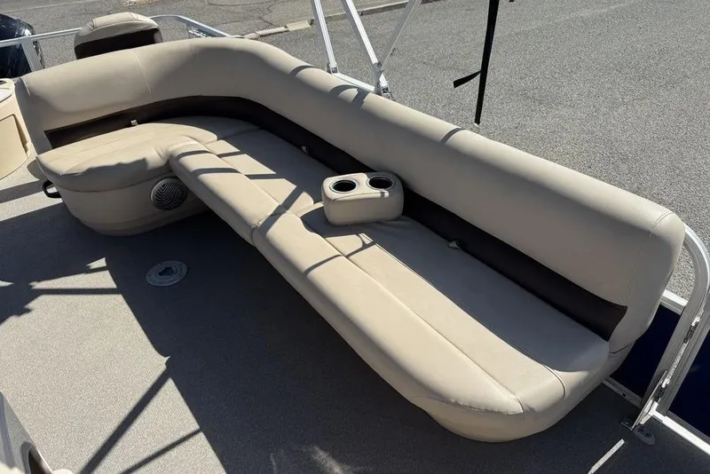 Slide: The Image of 2017 Sun Tracker FISHIN' BARGE® 20 DLX boat seating with cup holders, beige upholstery. - 38