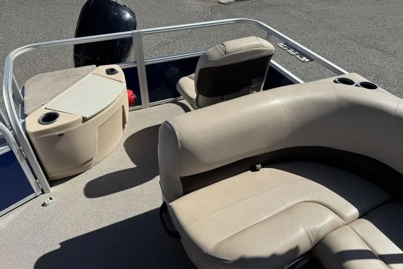 Slide: The Image of 2017 Sun Tracker FISHIN' BARGE® 20 DLX interior with beige seating and cup holders. - 39