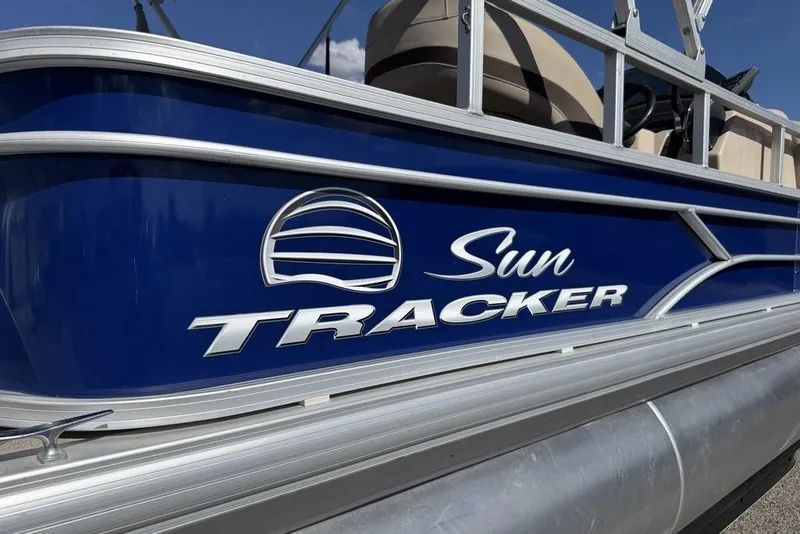 Slide: The Image of 2017 Sun Tracker FISHIN' BARGE® 20 DLX pontoon boat, blue exterior with logo. - 58