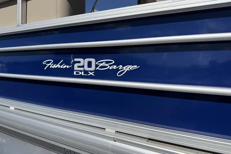 Slide: The Image of 2017 Sun Tracker FISHIN' BARGE® 20 DLX, blue exterior with model branding. - 60