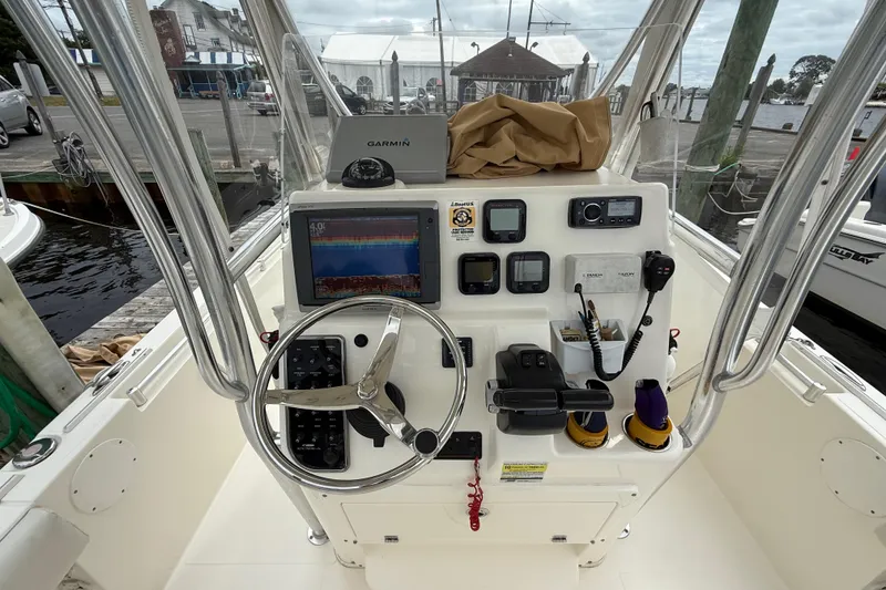 Slide: The Image of 2015 Cobia 256 Center Console boat dashboard with Garmin navigation system. - 29