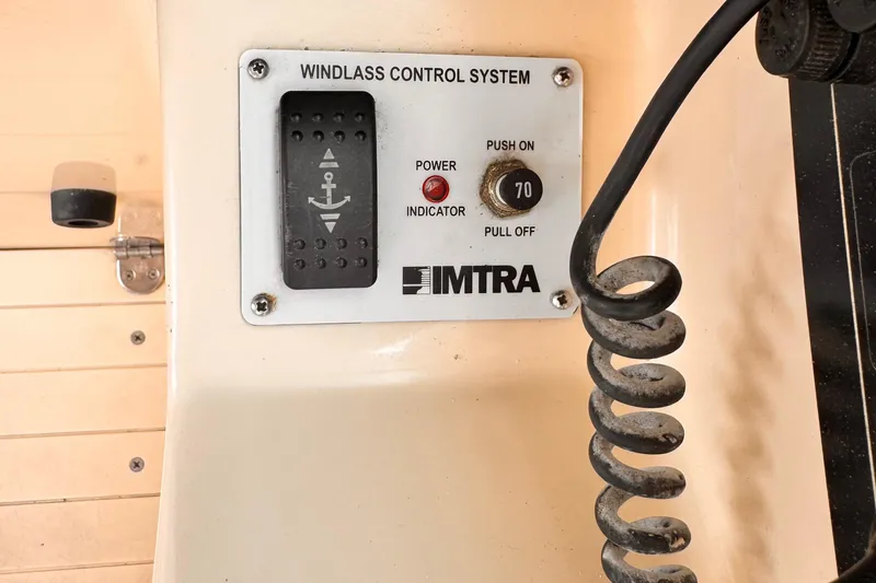 Slide: The Image of Windlass control system on 2003 Albin 28 TE boat, featuring IMTRA panel and coiled cable. - 27