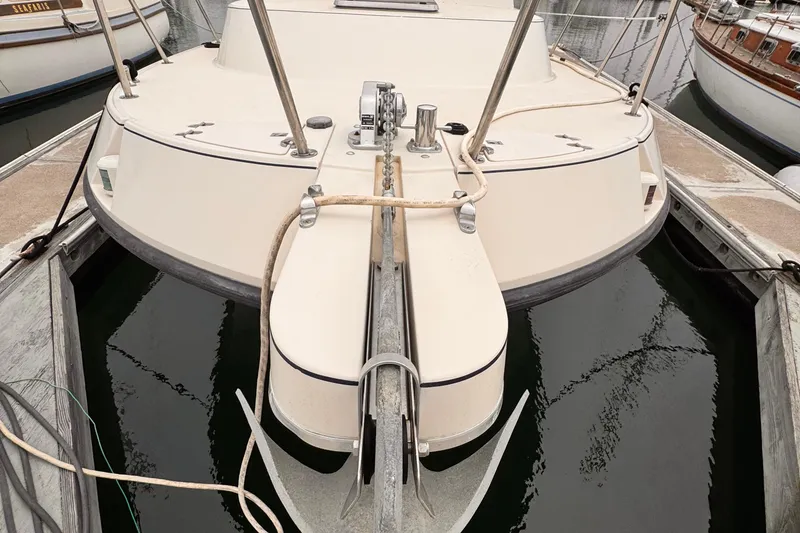 Slide: The Image of 2003 Albin 28 TE boat docked, showing stern and anchor details. - 36