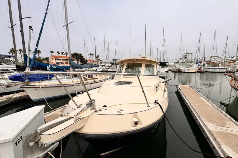 Slide: The Image of 2003 Albin 28 TE boat docked in a marina with sailboats. - 6