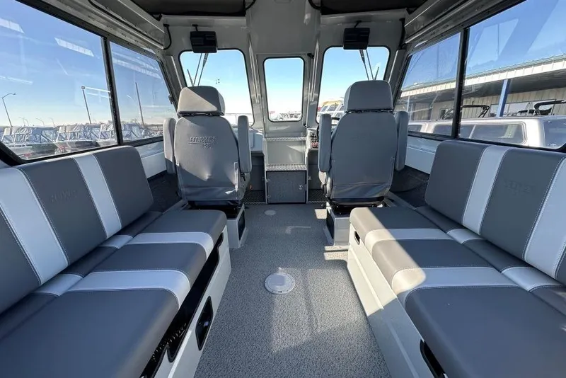 Slide: The Image of Interior of 2025 Hewescraft 240 Ocean Pro ET HT boat, featuring spacious seating and modern design. - 5