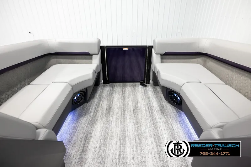 Slide: The Image of 2026 Bennington 22 MFBSE boat interior with plush seating and ambient lighting. - 15