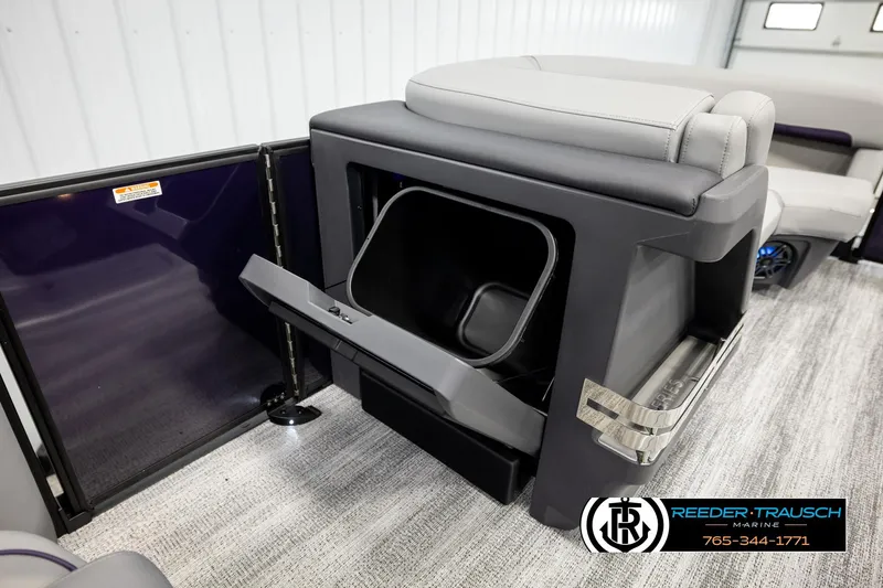 Slide: The Image of 2026 Bennington 22 MFBSE boat interior with storage compartment open, showcasing modern design. - 23