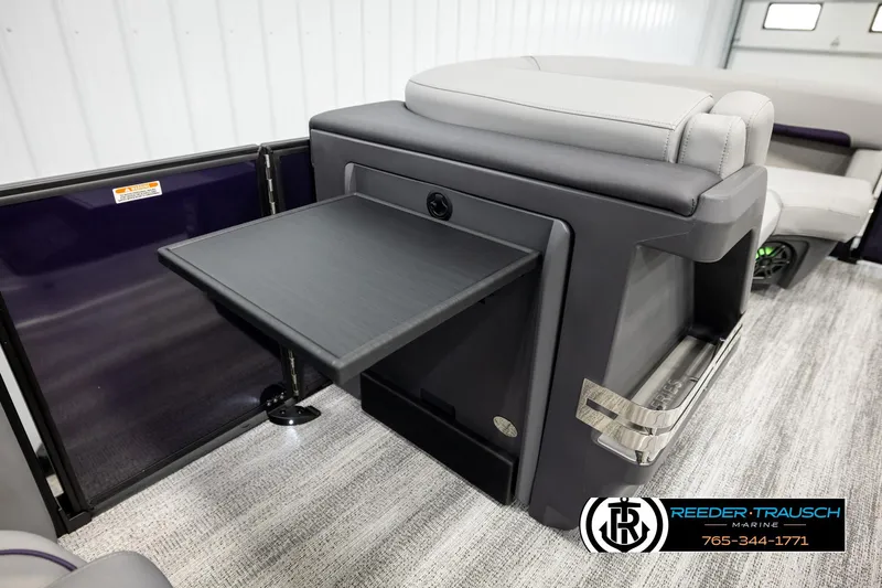Slide: The Image of 2026 Bennington 22 MFBSE boat interior with fold-out table and seating. - 24