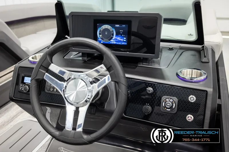 Slide: The Image of 2026 Bennington 22 MFBSE boat dashboard with steering wheel and digital display. - 27