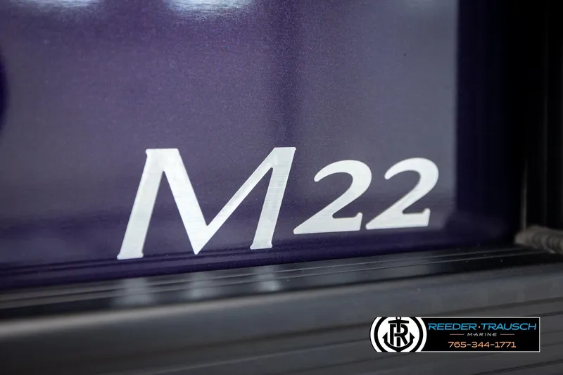 Slide: The Image of Close-up of 2026 Bennington 22 MFBSE model emblem on a dark surface. - 44