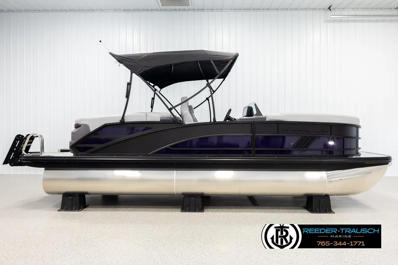 Slide: The Image of 2026 Bennington 22 MFBSE pontoon boat with canopy in showroom. - 5