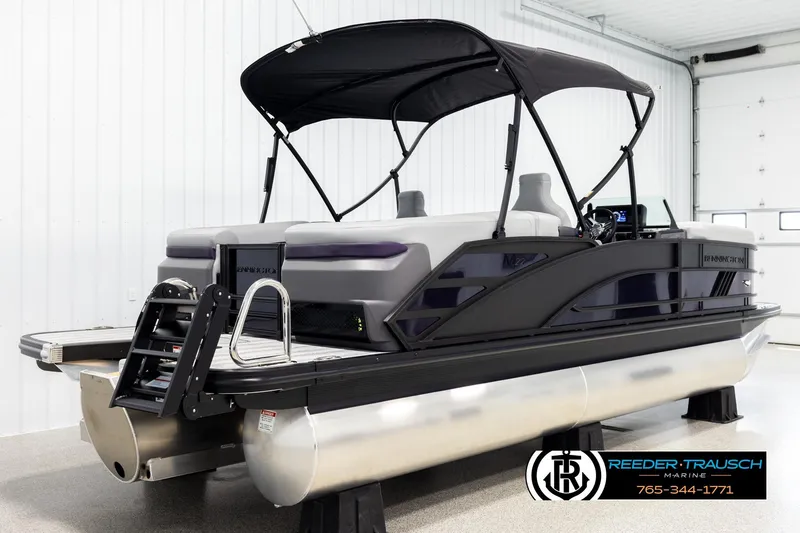 Slide: The Image of 2026 Bennington 22 MFBSE pontoon boat in showroom with canopy and modern design. - 6