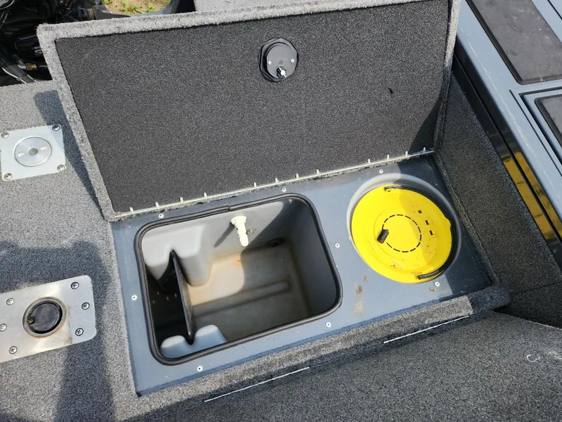 Slide: The Image of Open storage compartment in 2019 Tracker Targa V-18 Combo boat. - 10