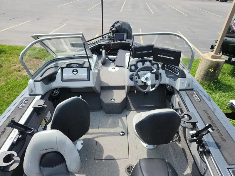 Slide: The Image of 2019 Tracker Targa V-18 Combo boat interior with steering wheel, seats, and control panels. - 13